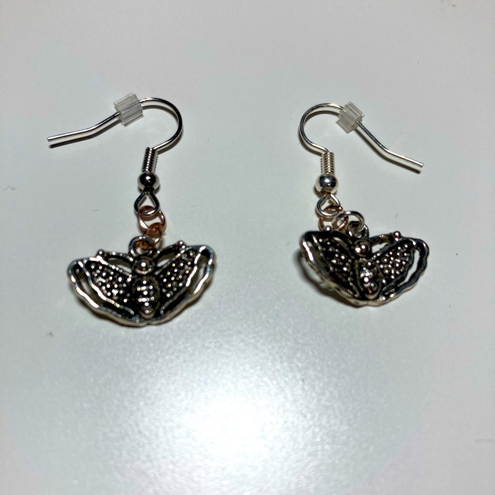 Handmade silver fluttering butterfly dangle earrings